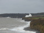 LZ00715 Waves crashing against cliffs at Llantwit Major beach.jpg